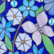 Mosaic work in progress by Diane Daley, butterflies and flowers in different shades of blue