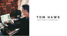 A picture of Tom in his studio composing digital music with a keyboard
