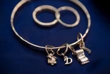 Charm bangle with three  charms: Book, Letter D and a key